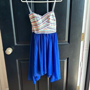 Size 7/8 multicolored strapless dress with zipper in back. NWT